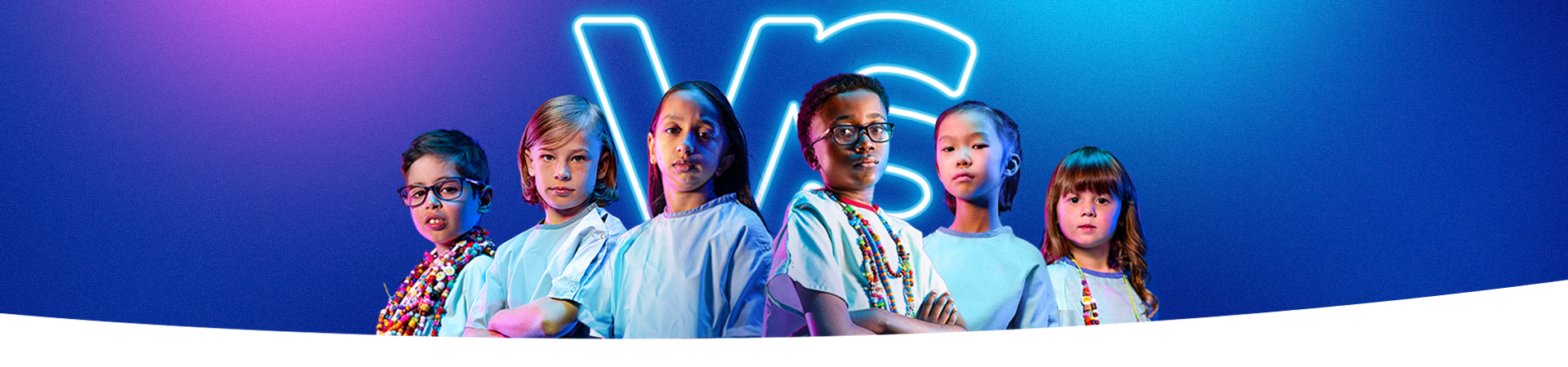 Six children standing together, crossing their arms. They are wearing hospital gowns, some are wearing colourful Bravery Beads around their neck.